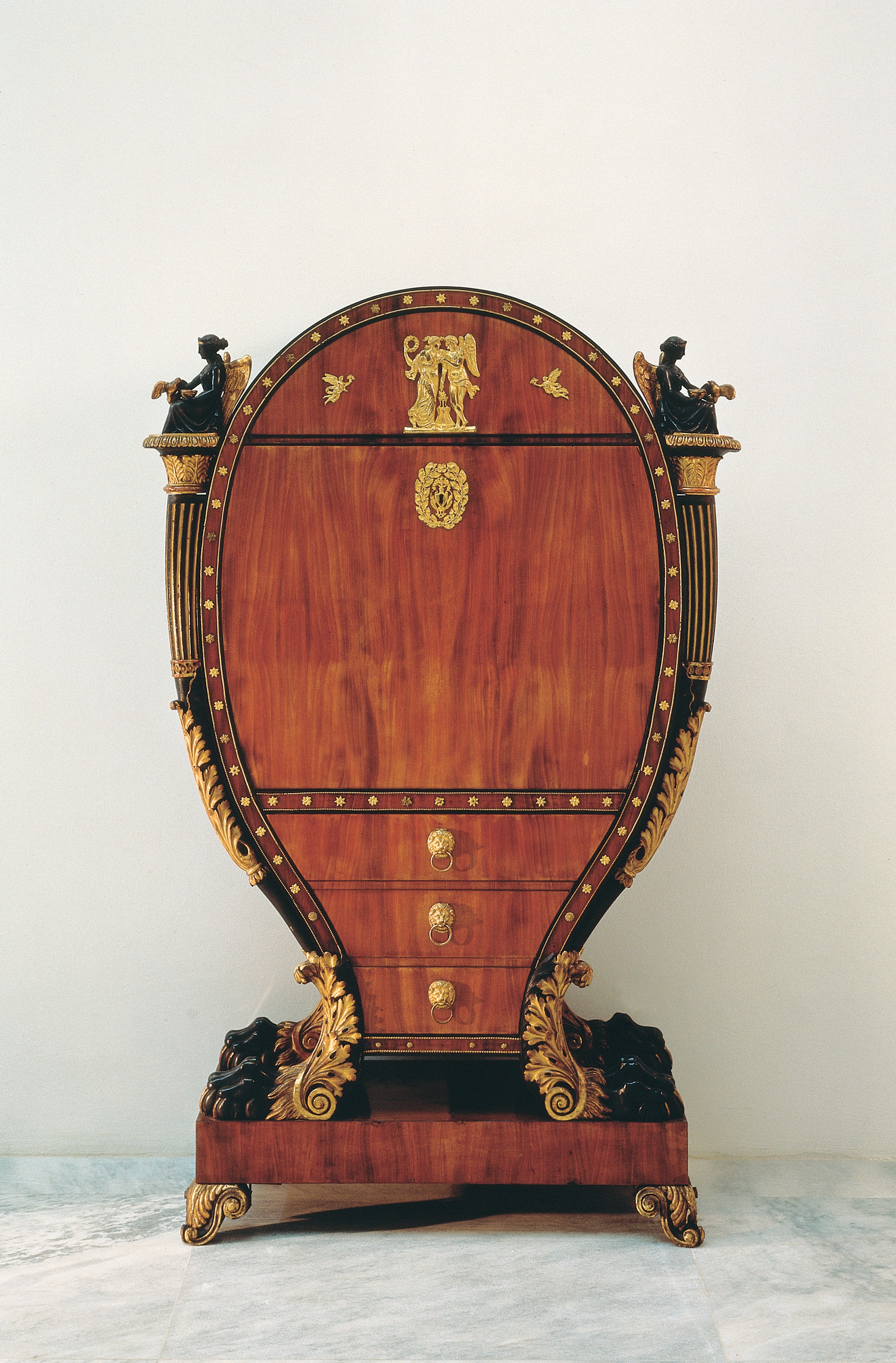 <BODY><div>BUREAU CABINET</div><div>Vienna, ca. 1815</div><div>Mahogany, black-stained wood, carved limewood, partly painted black and with verde-antique finish, partly gilded and bronzed; gilt brass and bronze fittings, partly solid and pressed; inside maple and red-stained grained wood</div><div>H 2027 / 1955</div></BODY>