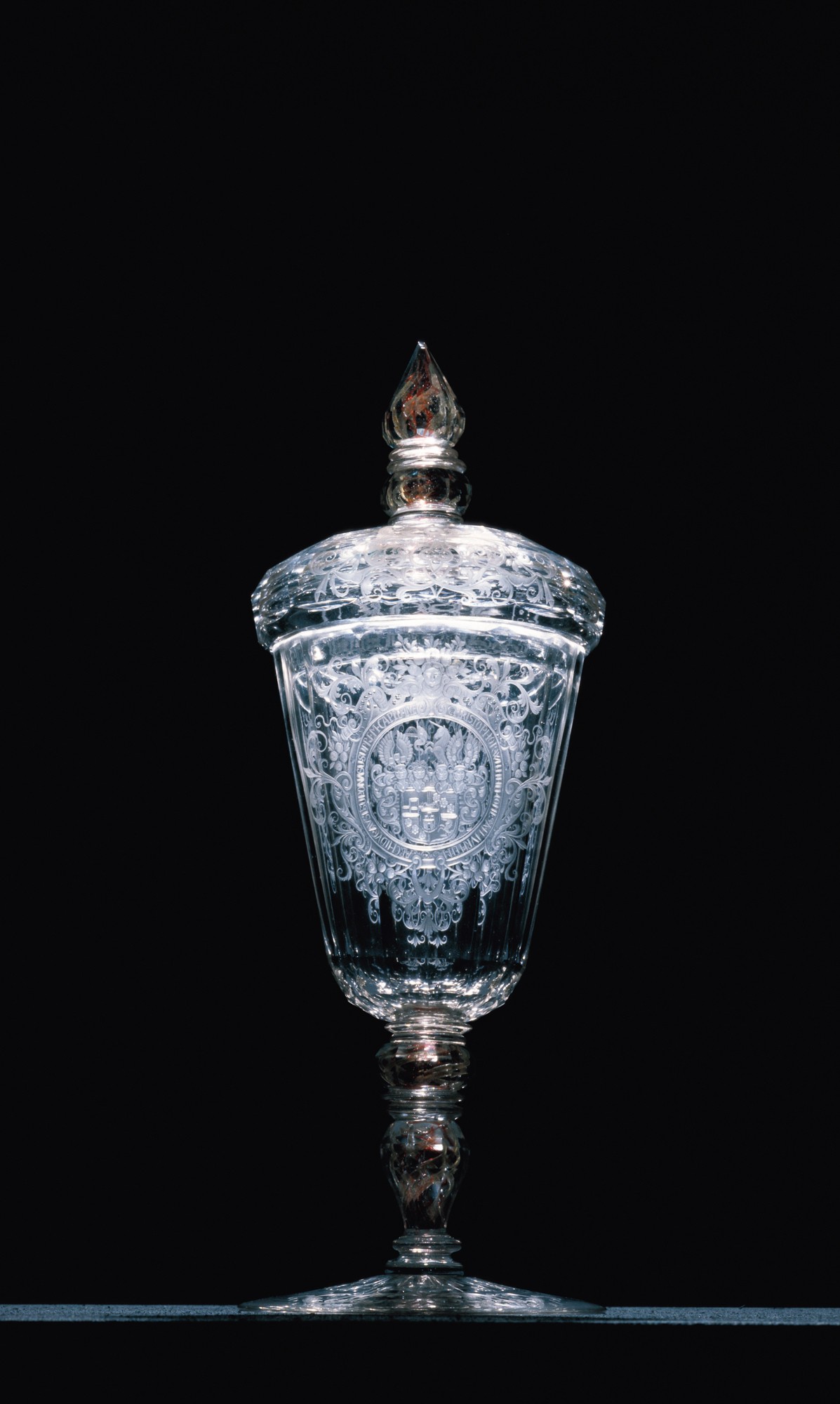 <BODY><div>BEAKER WITH HANDLE AND BASE</div><div>Bohemia, ca. 1725</div><div>Colorless glass, matte and polished cut, gilded silver</div><div>Gl 856 / 1871</div></BODY>