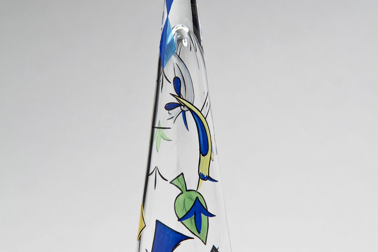 A pointed glass in the shape of a funnel with graphic elements